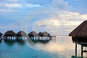 Over water villas at sunset