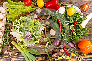 Overabundance of salad ingredients on table