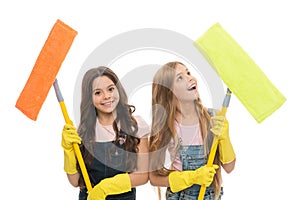 Overall cleaning. Cheerful small cleaning ladies. Cute girls holding mops for cleaning floor. Little cleaners happy