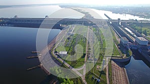 Overall view of the hydroelectric power station and electric substation flying orbit around. High voltage electric power