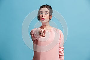 The overbearing business woman point you and want you, half length closeup portrait on blue background.