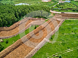 Overburden removal during sand pit preparation