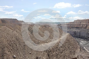 Overburden & the visible coal seam in a mine photo