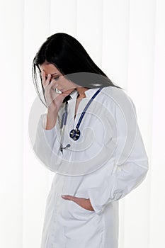 Overburdened doctor at the hospital in the stress photo