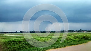 Overcast clouds in the rice field before it rains