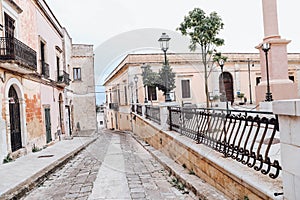 An overcast day in an empty street in the town of salve in puglia italy