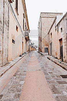 An overcast day in an empty street in the town of salve in puglia italy