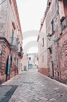 An overcast day in an empty street in the town of salve in puglia italy