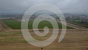 Overcast Day Over Rolling Agricultural Fields with Wind Turbines