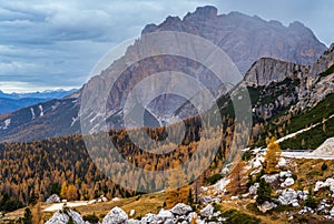 Overcast morning autumn alpine Dolomites mountain scene. Peaceful Valparola Path view, Belluno, Italy