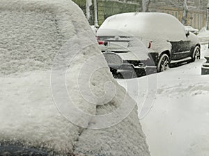 Overcast. Natural disasters winter, blizzard, heavy snow paralyzed city car roads, collapse. Snow covered cyclone