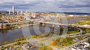 Overcast skies open for a moment to light the Hudson River and Downtown Albany State Capital