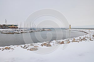 Overcast view of the snowy Lake Hefner lighthouse