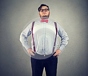 Overconfident chubby man in bowtie photo