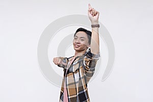 A overconfident and egotistical young man points up to the sky and himself and proclaiming himself to be number 1. photo