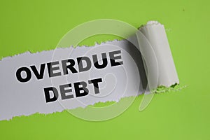 overdue debt text written in torn paper