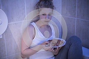 Overeating sad girl photo