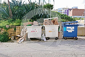 Overfilled waste containers dumpster for recycling waste plastic and paper