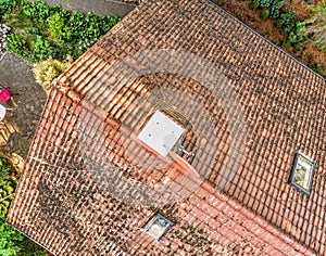 Overflight of the roof of a single-family house to check the condition of the roof tiles, aerial view