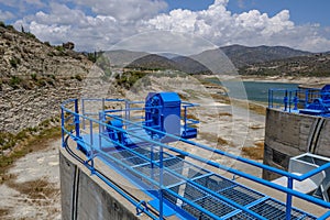 Overflow sluice gate painted in blue at the edge of the Germasogeia dam in Cyprus