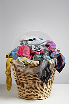 Overflowing laundry basket photo