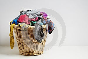 Overflowing laundry basket photo
