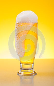 Overflowing pale lager beer