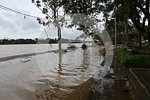 The overflowing waters of the Thu Bon River already reach the door of houses in Hoi An, Vietnam