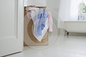 Overflowing Wicker Laundry Basket photo