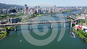 overflying Willamette River from Tilikum Crossing Bridge to Marquam Bridge, with USS Blueback Submarine in the River