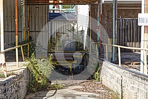 Overgrown industrial unloading dock area vintage style