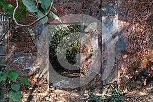 Overgrown ruins of an old abandoned Portuguese era house