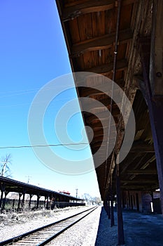 Overhang at an old rail station looking along the tracks photo
