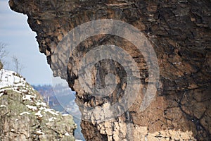 Overhanging part of the large, solitary rock Goldstein, which is part of the ensemble Bruchhauser Steine and the rock Bornstein in