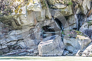 Overhanging rock above the river flow