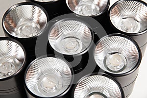 Overhead black LED lamps for a stretch ceiling on a white background. Close-up