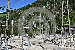 Overhead cables on electric poles together with expulsion fuses, surge arrester and other components.