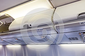 Overhead compartment - detail of an airplane cabin interior