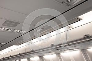 Overhead compartment row of an airplane cabin interior