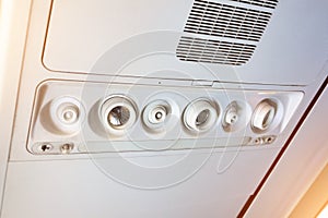 Overhead console in the modern passenger aircraft. air conditioner button and lighting switch, flight attendant call buttons