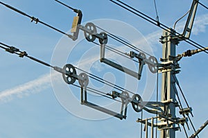 Overhead contact wires of electrified railway tracks kept under tension photo