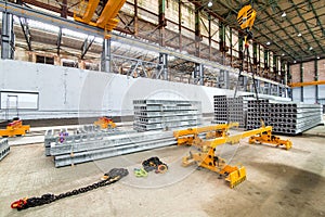 Overhead crane beam hoist concrete slab on a plant.