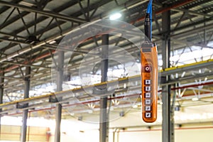 Overhead crane hand remote control panel in industrial building