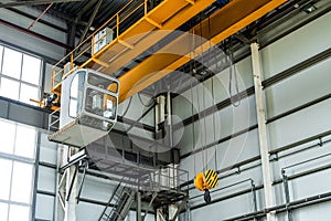 Overhead crane with hook in engineering plant shop