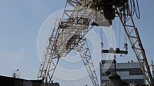 Overhead crane loads scrap metal