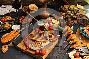 Overhead of dinner table. Assorted delicious grilled barbecue me