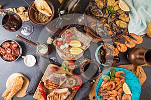 Overhead of dinner table. Assorted delicious grilled barbecue me