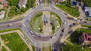 Overhead drone shot of beautiful park and busy roundabout