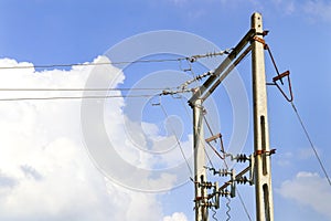 Overhead electric power lines with cable and Electric Transformer setup between farm land