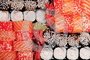 Overhead japanese sushi food. Rolls with tuna, salmon, shrimp, crab and avocado. Top view of assorted sushi, all you can eat menu